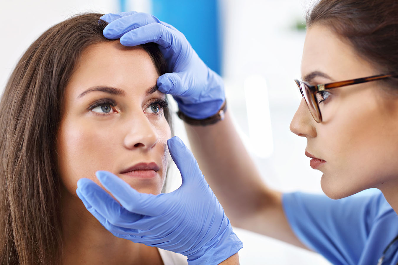 Picture of adult woman having a visit at female doctor's office